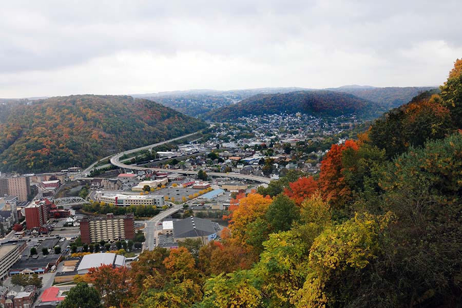 Lock Haven PA - Aerial View of the Town of Lock Haven Pennsylvania Surrounded by Mountains with Colorful Fall Foliage